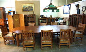 Original Vintage Gustav Stickley 5 leg stretcher base 60 inch dining table with 6 original leaves.  Opens to 11 feet.